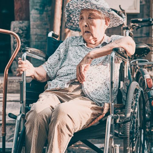 Old age lady sitting on wheelchair